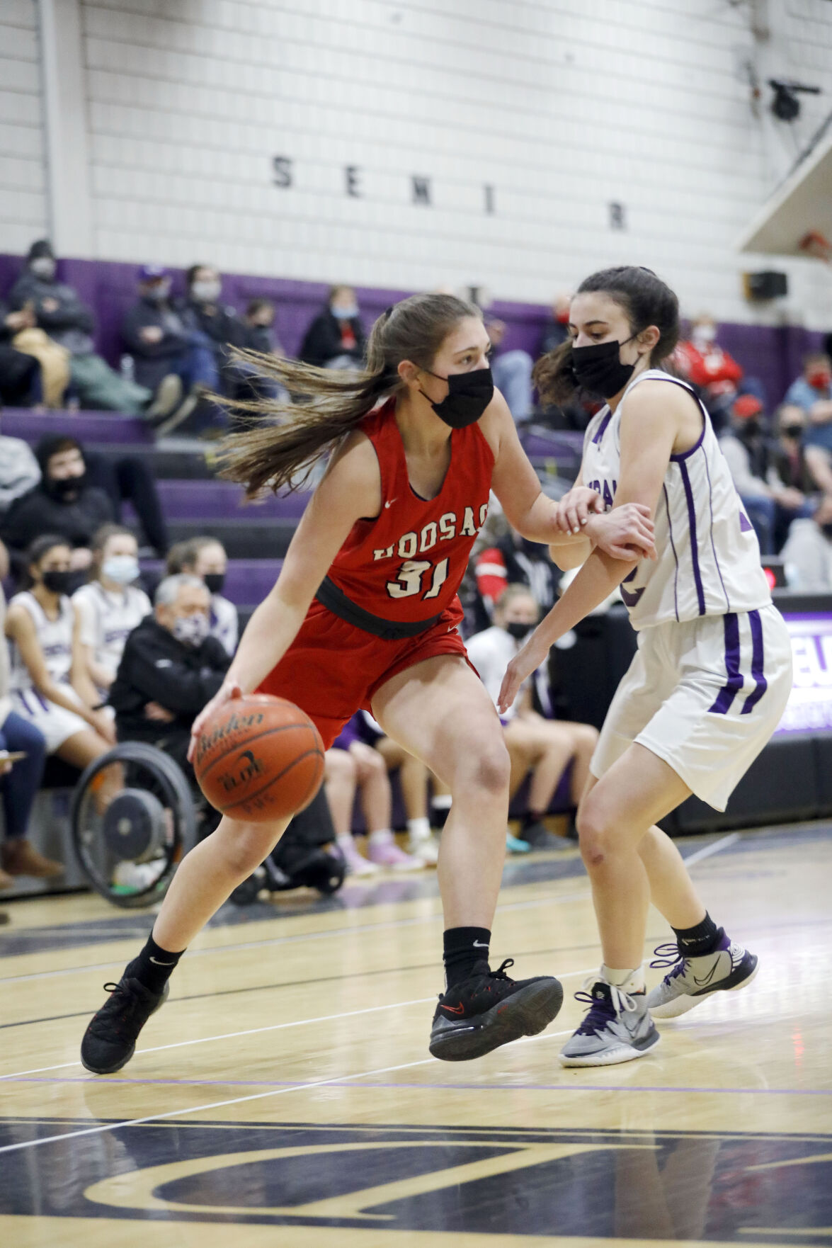 averie mcgrath pushes past randi duquette with basketball